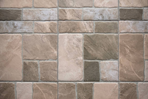 Modern lavatory wall proposing porcelain wall tiles with a marble end.
