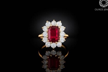 Ouros Jewels ruby halo ring with emerald-cut center stone and diamond accents in gold