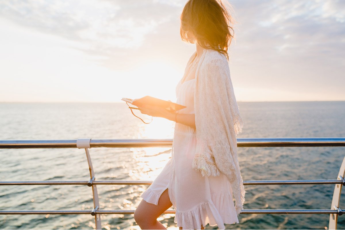 Woman enjoying the sun on a private ship